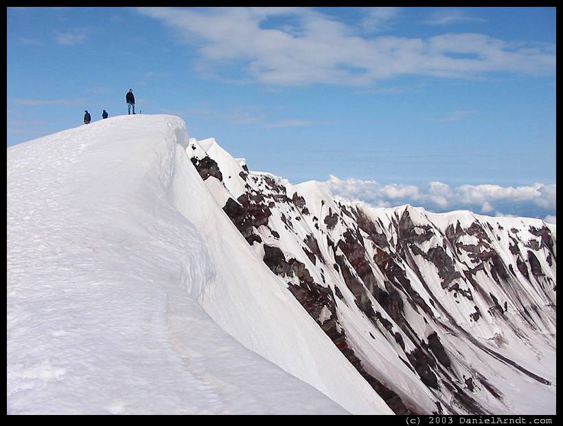 Climb of Mount St. Helens: on the crater rim, watching that cornice